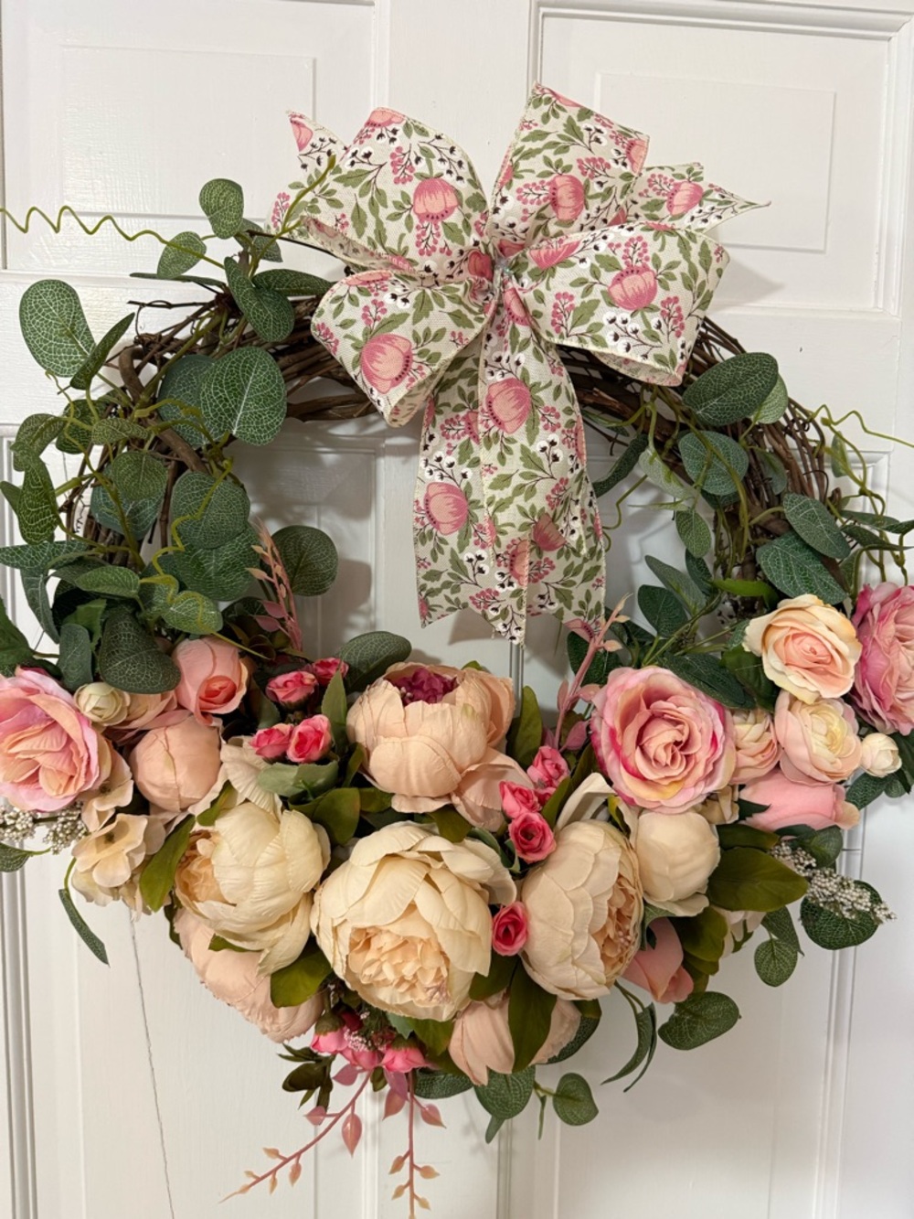 Pink & Cream Floral Wreath with Patterned Bow, measuring 23 x 23”